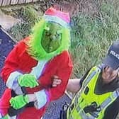 A caretaker dressed as the Grinch has been "arrested" by police - in a stunt to give nursery kids ''closure'' after a break-in. 
