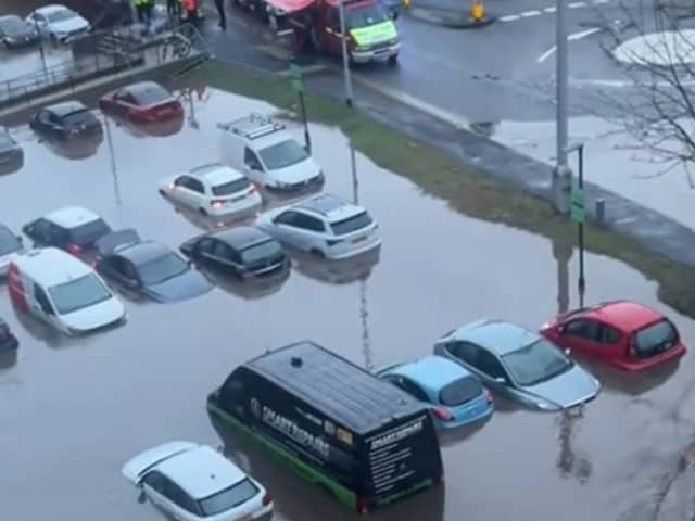A car park completely submerged in floodwater at Meadow Mill in Stockport.