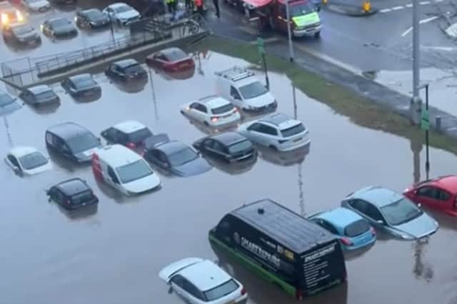 A car park completely submerged in floodwater at Meadow Mill in Stockport.