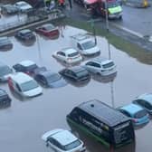 A car park completely submerged in floodwater at Meadow Mill in Stockport.