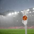 A general view of a corner flag during a hail storm during the Premier League match between Manchester United and Arsenal FC at Old Trafford on May 12, 2024 in Manchester, England.