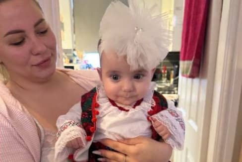 Six-month-old Sophia Kelemen with her family. Release date January 6 2025