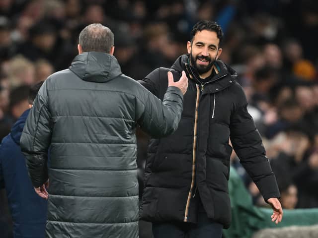 Ruben Amorim, Manager of Manchester United, congratulates Ange Postecoglou, Manager of Tottenham Hotspur, at the end of the Carabao Cup Quarter Final match between Tottenham Hotspur and Manchester United at Tottenham Hotspur Stadium on December 19, 2024 in London, England.