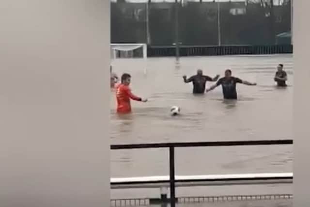 Lydney Town AFC players swim in flooded pitch