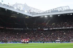 General view inside the stadium, as both teams huddle prior to the Premier League match between Manchester United FC and AFC Bournemouth at Old Trafford on December 22, 2024 in Manchester, England. (