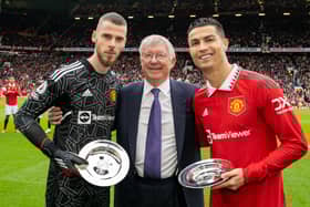 Former Manager Sir Alex Ferguson congratulates Cristiano Ronaldo and David de Gea of Manchester United on their achievements ahead of the Premier League match between Manchester United and Newcastle United at Old Trafford on October 16, 2022 in Manchester, England.