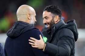 Pep Guardiola, Manager of Manchester City, and Ruben Amorim, Manager of Manchester United, interact prior to the Premier League match between Manchester City FC and Manchester United FC at Etihad Stadium on December 15, 2024 in Manchester, England.