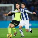 Martin Zubimendi of Real Sociedad duels for the ball with Giovani Lo Celso of Real Betis during the LaLiga match between Real Sociedad and Real Betis Balompie at Reale Arena on December 01, 2024 in San Sebastian, Spain.