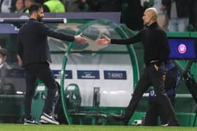 Man Utd coach Ruben Amorim (L) greets Manchester City's Spanish manager Pep Guardiola