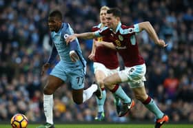 Kelechi Iheanacho of Manchester City is challenged by Michael Keane of Burnley during the Premier League match between Manchester City and Burnley at Etihad Stadium on January 2, 2017 in Manchester, England. 
