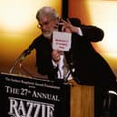 Presenter John Wilson announces the winner for  "Worst Picture",  "Basic Instinct 2" announced as "Basically it Stinks Too" during the Razzie Awards in Hollywood, CA, 24 February 2007.