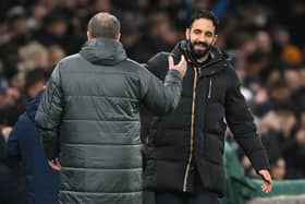Ruben Amorim, Manager of Manchester United, congratulates Ange Postecoglou, Manager of Tottenham Hotspur, at the end of the Carabao Cup Quarter Final match between Tottenham Hotspur and Manchester United at Tottenham Hotspur Stadium on December 19, 2024 in London, England.