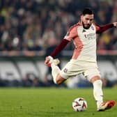 Rayan Cherki of Olympique Lyonnais takes a shot during the UEFA Europa League 2024/25 League Phase MD7 match between Fenerbahce SK and Olympique Lyonnais at  on January 23, 2025 in Istanbul, Turkey. 