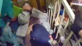 The woman hiding under a pile of children's toys