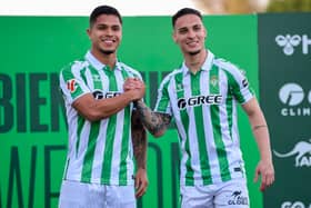 Real Betis' new Brazilian player Antony Santos (R) and new Colombian player Cucho Fernandez pose during their presentations at the Ciudad Deportivo Luis del Sol in Seville on February 5, 2025