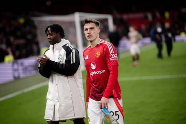 Manuel Ugarte and Kobbie Mainoo of Manchester United applaud the fans after the Emirates FA Cup Fourth Round match between Manchester United and Leicester City at Old Trafford on February 07, 2025 in Manchester, England. 