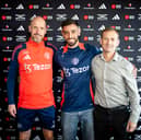 Erik ten Hag and Dan Ashworth pose with Bruno Fernandes after he signed a new contract with the club