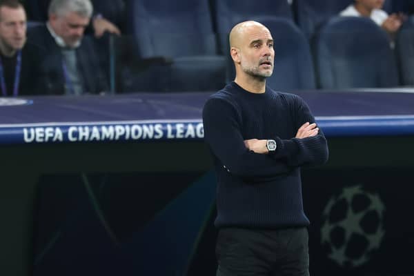 Pep Guardiola, Manager of Manchester City, looks on during the UEFA Champions League 2024/25 League Knockout Play-off second leg match between Real Madrid C.F. and Manchester City at Santiago Bernabeu Stadium on February 19, 2025 in Madrid, Spain
