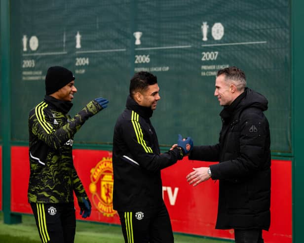 Robin van Persie attends a Manchester United training session in February 2023