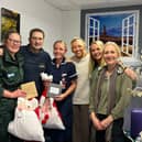 Ian with family and medics