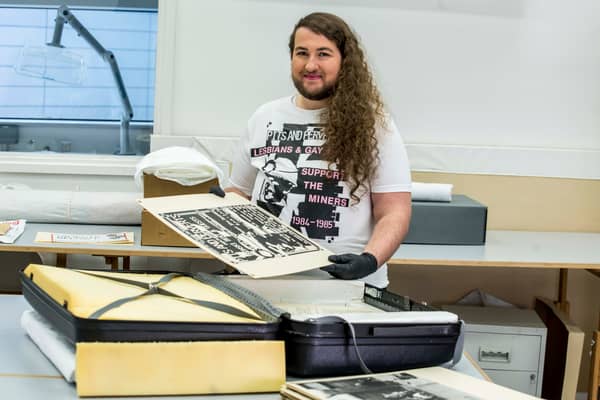 Jaime Starr, PHM Collections Assistant, handling LGSM suitcase, 1985. NMLH.2002.6. Image courtesy of People's History Museum