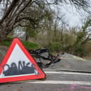 A road left so badly damaged by a landslip it was closed to cars can't be fixed properly - as it's still moving a YEAR later.  