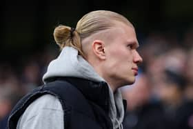 Erling Haaland of Manchester City looks on, as he is seen in the stand, due to been unable to play because of a injury prior to the Premier League match between Manchester City FC and Liverpool FC at Etihad Stadium on February 23, 2025 in Manchester, England. 