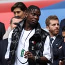 French midfielder paul Pogba (L) attends the UEFA Euro 2024 round of 16 football match between France and Belgium at the Duesseldorf Arena in Duesseldorf on July 1, 2024.