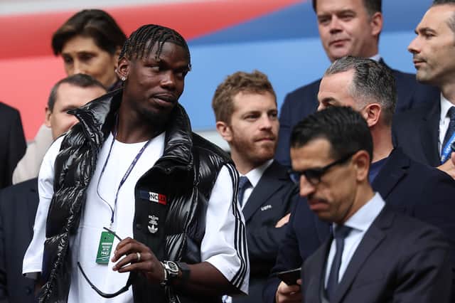 French midfielder paul Pogba (L) attends the UEFA Euro 2024 round of 16 football match between France and Belgium at the Duesseldorf Arena in Duesseldorf on July 1, 2024.