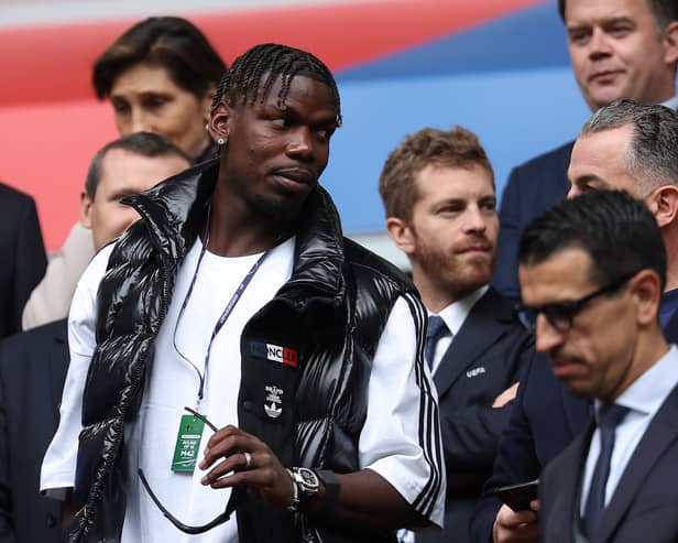 French midfielder paul Pogba (L) attends the UEFA Euro 2024 round of 16 football match between France and Belgium at the Duesseldorf Arena in Duesseldorf on July 1, 2024.