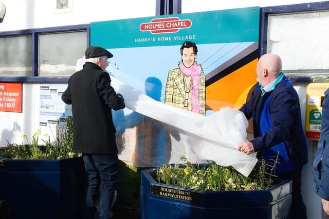 Tony Wright and Graham Blake unveil the artwork. An incredible mural of global megastar Harry Styles has been unveiled in the tiny village where he grew up.