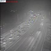 M61 traffic stopped after a coach caught fire