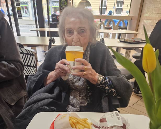 95-year-old Betty Timmis with her first ever McDonald's meal. 