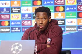 Jonathan David speaks during a press conference on the eve of the UEFA Champions League football match LOSC Lille against Borussia Dortmund, at the LOSC training centre