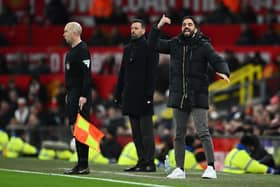 Ruben Amorim, Head Coach of Manchester United, gives the team instructions as Ruud van Nistelrooy, Manager of Leicester City, looks on during the Emirates FA Cup Fourth Round match between Manchester United and Leicester City at Old Trafford on February 07, 2025 in Manchester, England. 