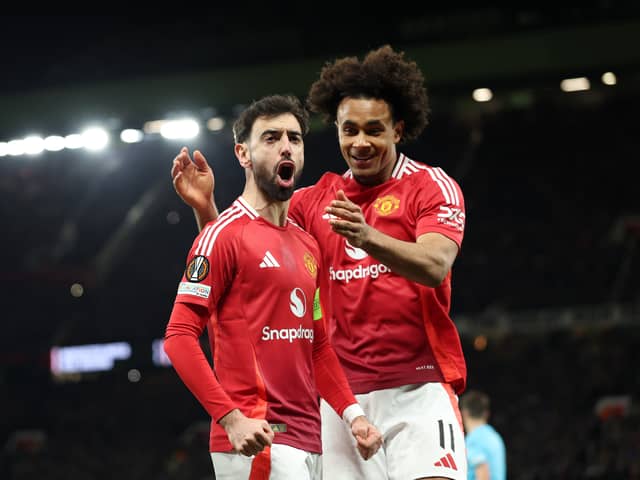 Bruno Fernandes of Manchester United celebrates scoring his team's first goal with teammate Joshua Zirkzee during the UEFA Europa League 2024/25 Round of 16 Second Leg match between Manchester United and Real Sociedad de Futbol at Old Trafford on March 13, 2025 in Manchester, England. 