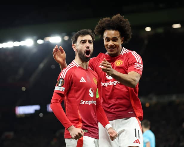 Bruno Fernandes of Manchester United celebrates scoring his team's first goal with teammate Joshua Zirkzee during the UEFA Europa League 2024/25 Round of 16 Second Leg match between Manchester United and Real Sociedad de Futbol at Old Trafford on March 13, 2025 in Manchester, England. 