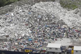 A drone picture shows huge piles of waste close to the Pioneer Mill site in Radcliffe