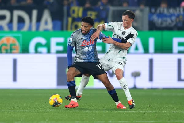 Empoli's Liam Henderson, right, challenges Ederson of Atalanta.