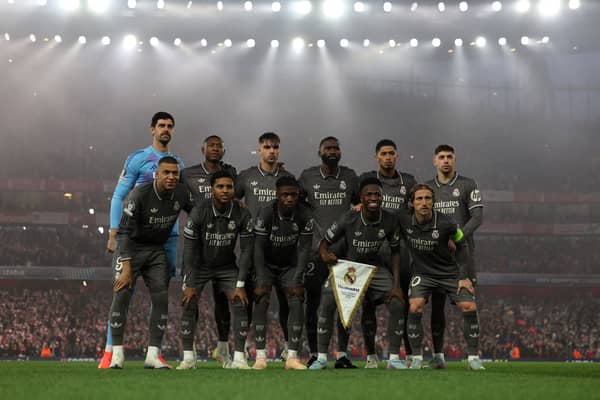 Vinicius Junior lines up with his Real Madrid teammates ahead of their defeat to Arsenal