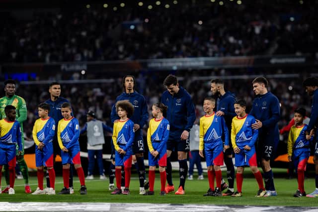 Bruno Fernandes, Andre Onana, Casemiro, Diogo Dalot, Leny Yoro, Noussair Mazraoui, Manuel Ugarte, Patrick Chinazaekpere Dorgu, Rasmus Hojlund of Manchester United line up ahead of the UEFA Europa League 2024/25 Quarter Final First Leg match between Olympique Lyonnais and Manchester United at OL Stadium on April 10, 2025 in Decines-Charpieu, France.