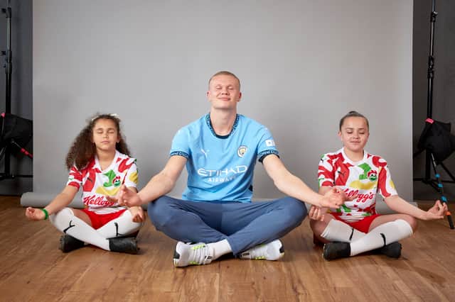 Erling Haaland meditating with children for Kellogg's new shirt launch photo shoot