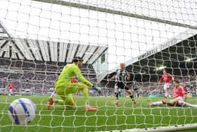 Harvey Barnes of Newcastle United shoots to score the second goal past goalkeeper Altay Bayindir of Manchester United during the Premier League match between Newcastle United FC and Manchester United FC at St James' Park on April 13, 2025 in Newcastle upon Tyne, England.