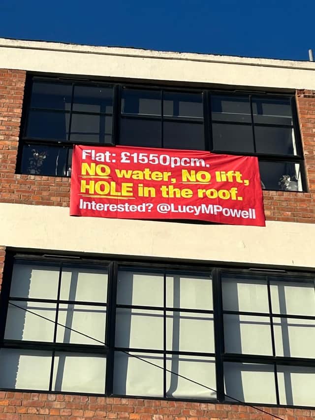 Angry residents place sign outside their Manchester City Centre flat where a paddling pool was used to fix a leak