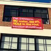 Angry residents place sign outside their Manchester City Centre flat where a paddling pool was used to fix a leak