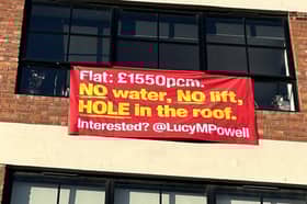 Angry residents place sign outside their Manchester City Centre flat where a paddling pool was used to fix a leak