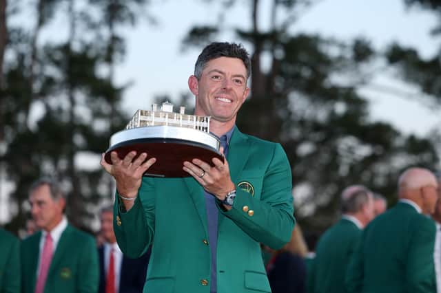 Rory McIlroy of Northern Ireland poses with the Masters trophy during the Green Jacket Ceremony after winning the 2025 Masters Tournament at Augusta National Golf Club on April 13, 2025 in Augusta, Georgia.