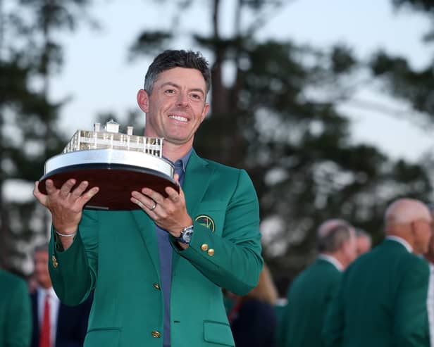Rory McIlroy of Northern Ireland poses with the Masters trophy during the Green Jacket Ceremony after winning the 2025 Masters Tournament at Augusta National Golf Club on April 13, 2025 in Augusta, Georgia.