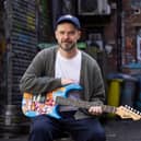 Manchester artist Hammo with guitar artwork for "Music for the Senses"