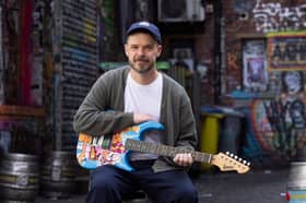 Manchester artist Hammo with guitar artwork for "Music for the Senses"